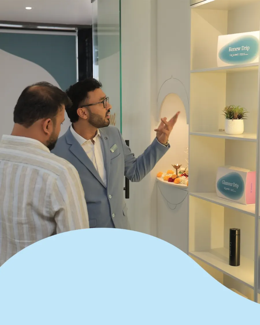 Dr. Dhrumit Gohil shows guests the IV drip shelf at Izumi