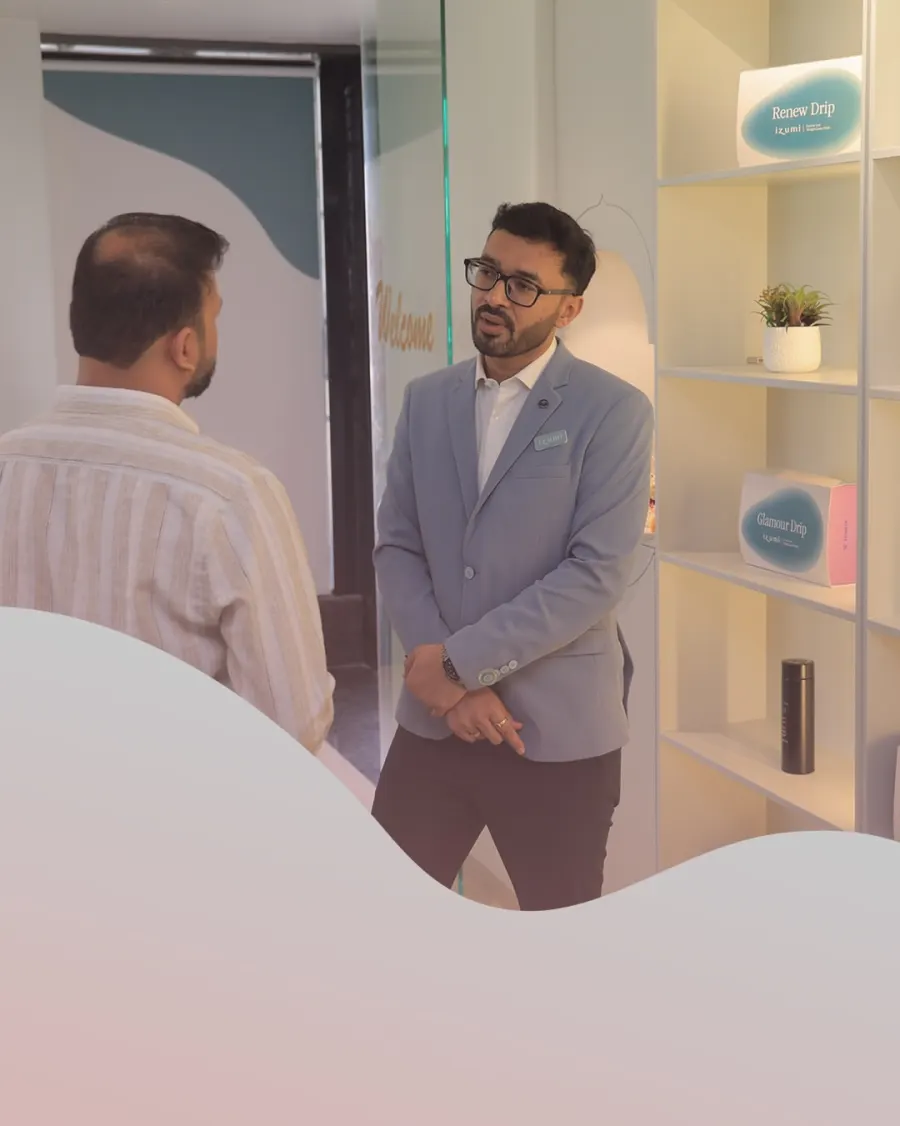 Dr. Dhrumit Gohil in the Izumi clinic corridor